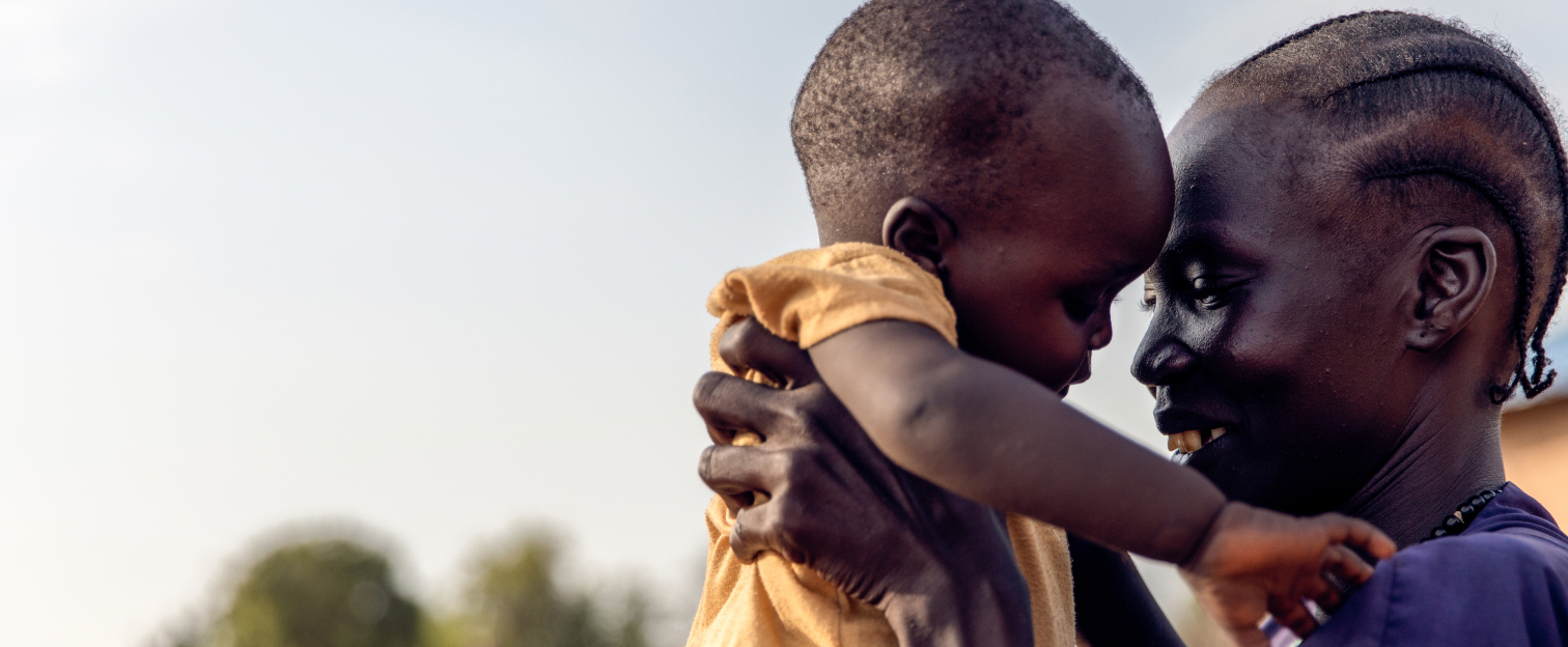 Veronica, 31, holds her youngest child at home in Jamjang, South Sudan.